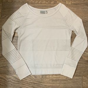 Long sleeve Athleta shirt with cut-out details, laser cut like throughout
